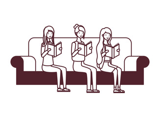 women sitting on chair with book in hands