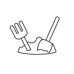 silhouette of shovel and rake to play on the beach