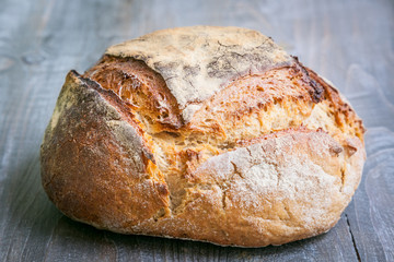 Loafs (or miche) of French sourdough, called as well as Pain de campagne, on display on a wooden...