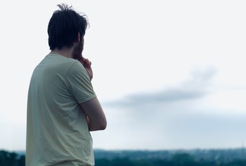 man looking at the sea