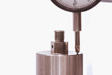 Close up of Dial gauge measure the part after production process to check the precision and...