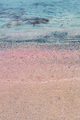 Colorful sand on tropical beach. Copy space.