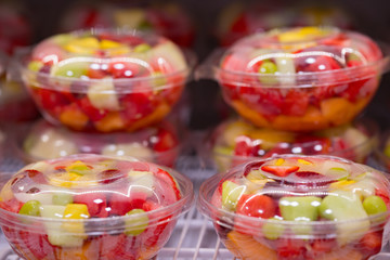 Colorful fruit bowls at a supermarket summer snack