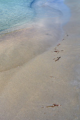 Colorful sand on tropical beach. Copy space.