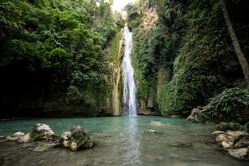 Mantayupan Falls in Barili Cebu, Philippines in the morning with bright sun