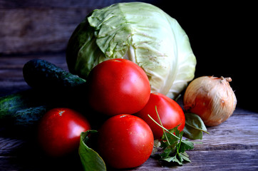Vegetables from the garden in the village, tomatoes, cucumbers, cabbage, onions.