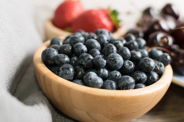 Fresh Summer Berries on Rustic Wooden Background