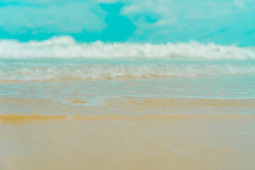 Tropical nature clean beach and white sand in summer with sun light blue sky and bokeh background.