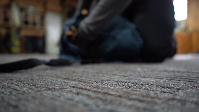 Packing a parachute for a skydiver in slow motion