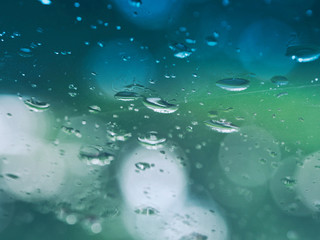 Fototapeta na wymiar Rain drop on glass of window in rainy day.