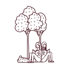 women sitting with book in landscape with trees and plants