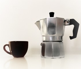 teapot and cup on white background