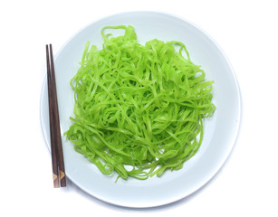 green noodles on dish isolated on white background