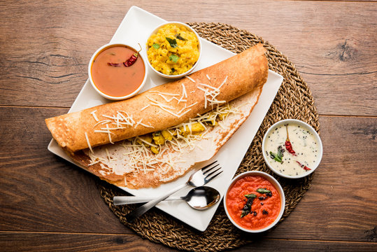 cheese masala dosa recipe with sambar and chutney, selective focus