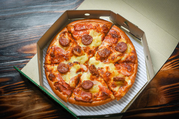 pizza in box / delicious tasty fast food italian traditional pizza cheese