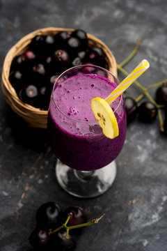 Juice of jamun fruit in a glass also called as java plum, jambolan plum, jambhul, syzygium cumini