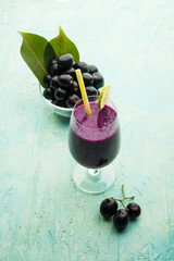 Juice of jamun fruit in a glass also called as java plum, jambolan plum, jambhul, syzygium cumini