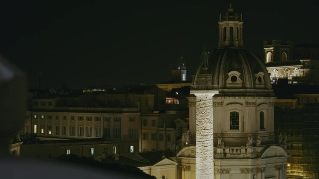 Slow zoom in of Trajan's Column "Colonna Traiana", and Church of the Most Holy Name of Mary at the Trajan Forum "Santissimo Nome di Maria al Foro Traiano". Rome, Italy.  Shot on Red Monstro 8K. In 4K