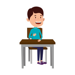 happy student boy seated in school desk