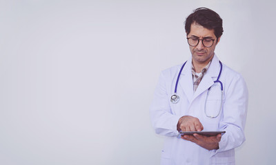 doctor checking patient information on a tablet device