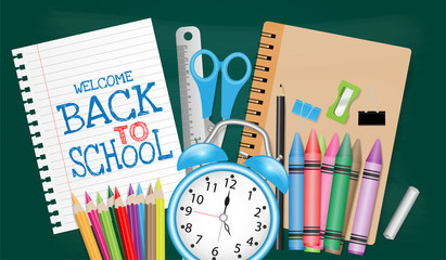 Back to school concept with school supplies on chalkboard background