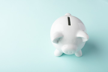 Gilt piggy bank on a blue background. Money saving concept. Saving. view from above
