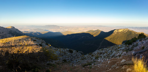 A panoramic view south to Cartagena from the summit of Morron in the Sierra Espuna mountain range in Spain. It's just before sunset.