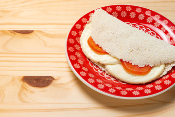 Casabe (bammy, beiju, bob, biju). Flatbread of cassava (tapioca) with caprese salad (tomato,...
