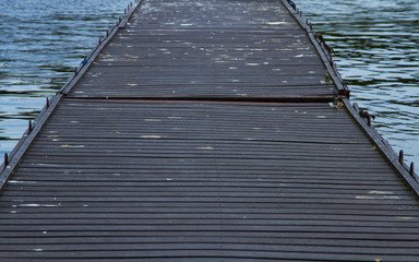 Fototapeta premium Wooden jetty going into the water