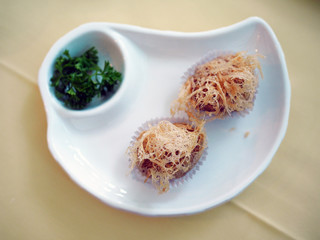 Deep fried mashed taro served with sweet and sour plum sauce, Chinese food style. Selective focus.