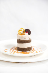 Tiramisu cake dessert with oreo and red cherry, sweet, tasty, delicious