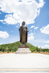 buddha image stand front green mountain