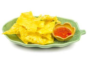 Thai style spicy instant noodles soup in bowl, Yentafo Tom Yum with Thai herbs, Thai food, Noodle soup on white background.