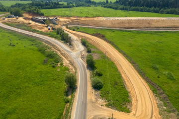 Fototapeta na wymiar Aerial view on the construction of a new highway in the countryside