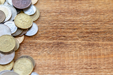 coins Pile pack heap on a wooden background with space for an inscription copy space mock up selective focus close up