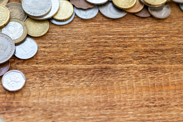 coins Pile pack heap on a wooden background with space for an inscription copy space mock up selective focus close up