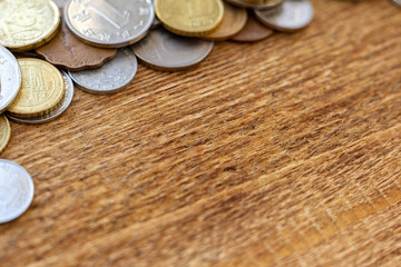 coins Pile pack heap on a wooden background with space for an inscription copy space mock up selective focus close up