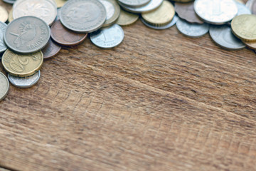 coins Pile pack heap on a wooden background with space for an inscription copy space mock up selective focus close up