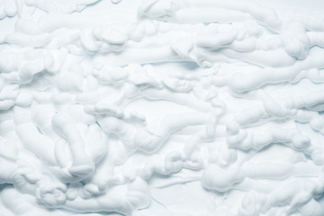 White foam texture abstract art background. Closeup of layered mousse effect surface.
