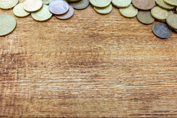 coins Pile pack heap on a wooden background with space for an inscription copy space mock up selective focus close up
