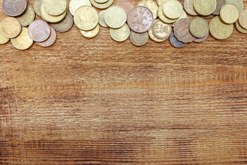 coins Pile pack heap on a wooden background with space for an inscription copy space mock up selective focus close up