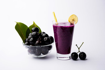 Juice of jamun fruit in a glass also called as java plum, jambolan plum, jambhul, syzygium cumini