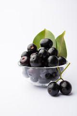 Juice of jamun fruit in a glass also called as java plum, jambolan plum, jambhul, syzygium cumini