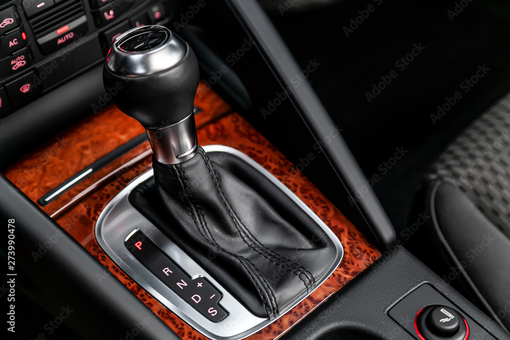 Aufkleber close-up of the accelerator handle with brown artificial panels under the tree. automatic transmissi