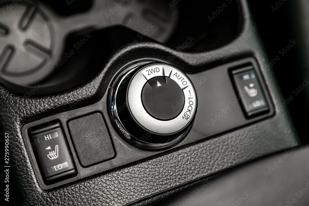 Poster close up 2wd, auto, lock button switches control for car with soft-focus and over light in the backg