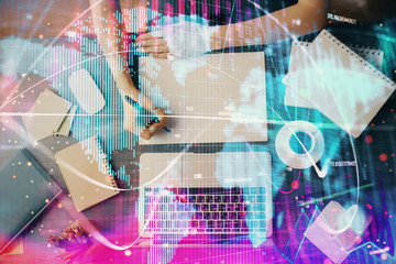 International business hud over woman's hands writing background. Concept of hard work. Double exposure