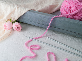 Pink threads on a gray tray, concept hand made, copy space.