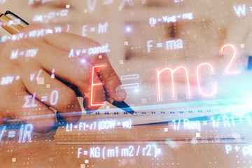 Student or teacher with mathematical and scientific formulas. Concepts of education.