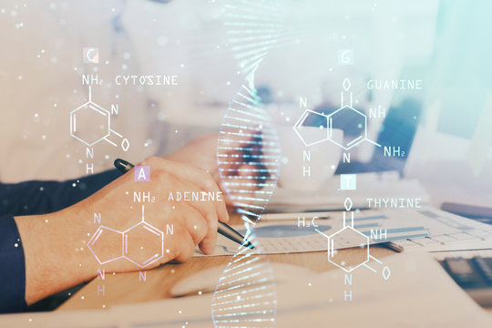 Man's hands working with notes background. Genetic engineering and gene manipulation concept.