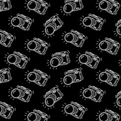 Pattern with graphic photo camera on black background. Great element for travel design.